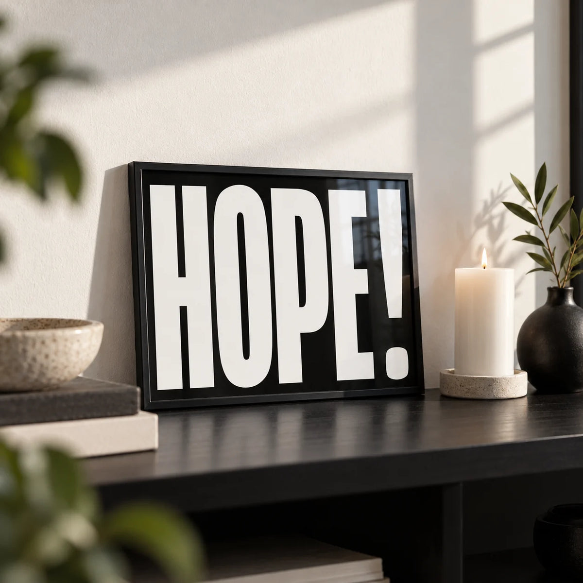 Inspirational Artwork, a small A4 framed print leaning on a black shelf in a living room