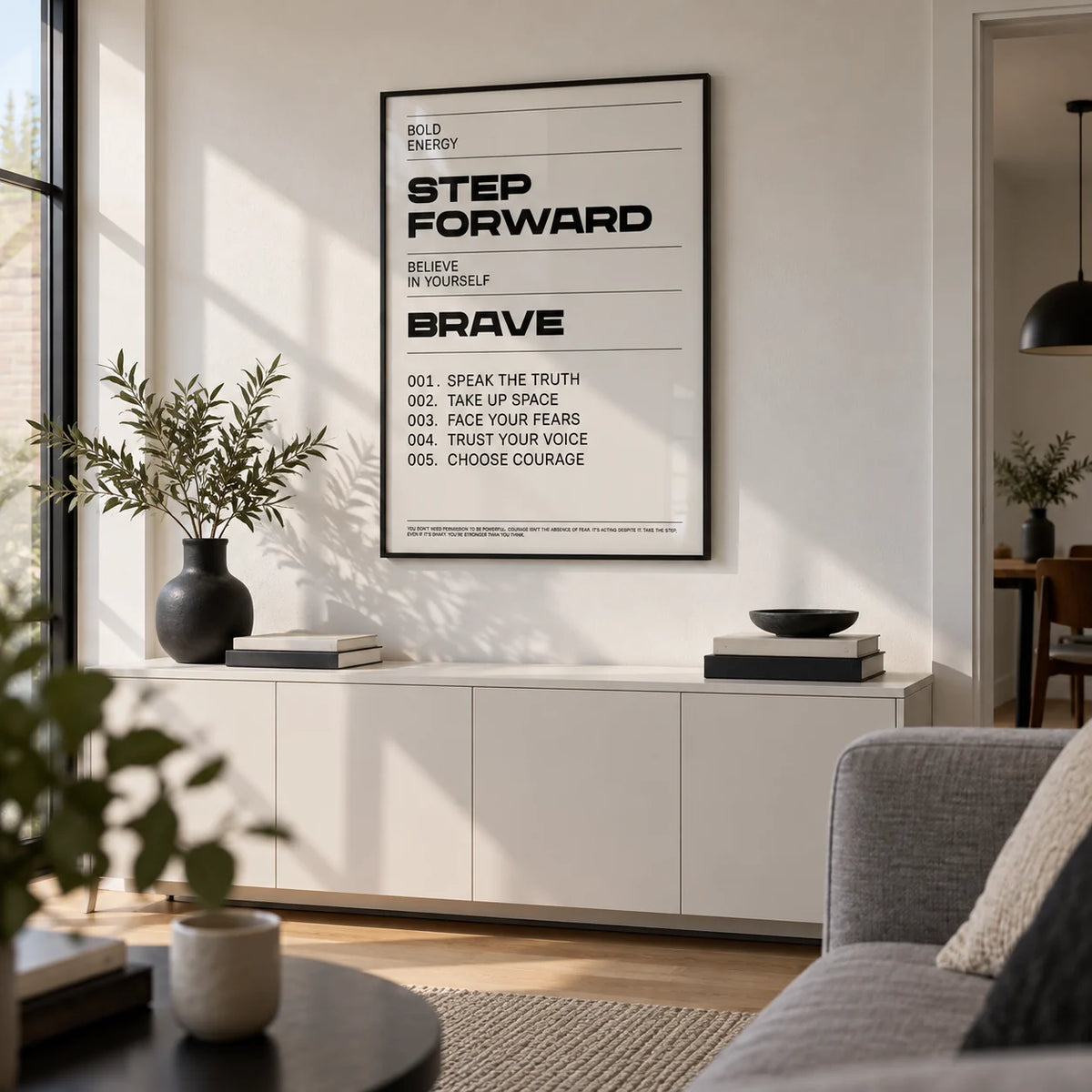 Inspirational Quotes Artwork, framed on the wall of a first-flat living room with a white wall
