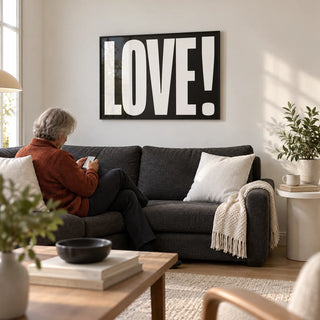 Inspired Posters, framed on the wall of a modern living room with a white wall and a pale oak floor