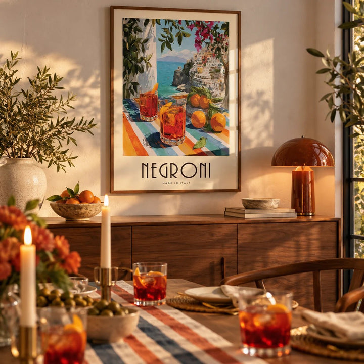 Italian Drink Posters, framed on the wall of a dining room set for dinner