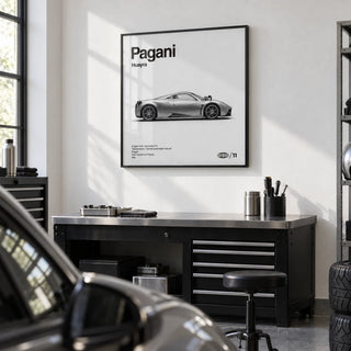 Italian Hypercar Poster, framed on the wall of a clean garage studio with a white wall and a grey epoxy floor in a home office