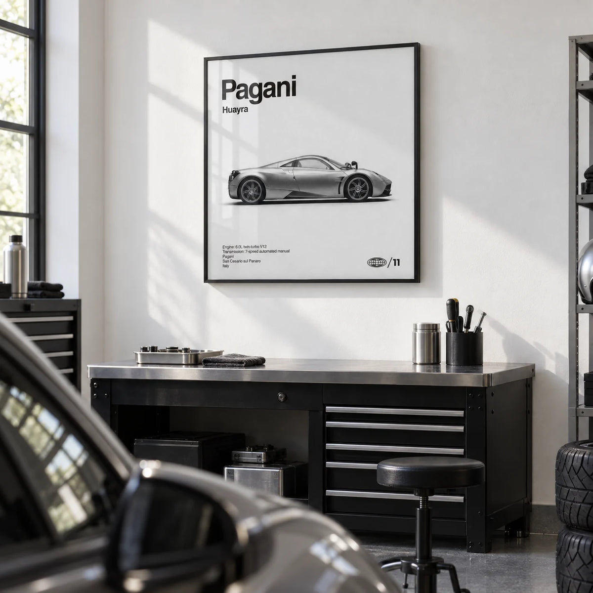 Italian Hypercar Poster, framed on the wall of a clean garage studio with a white wall and a grey epoxy floor in a home office