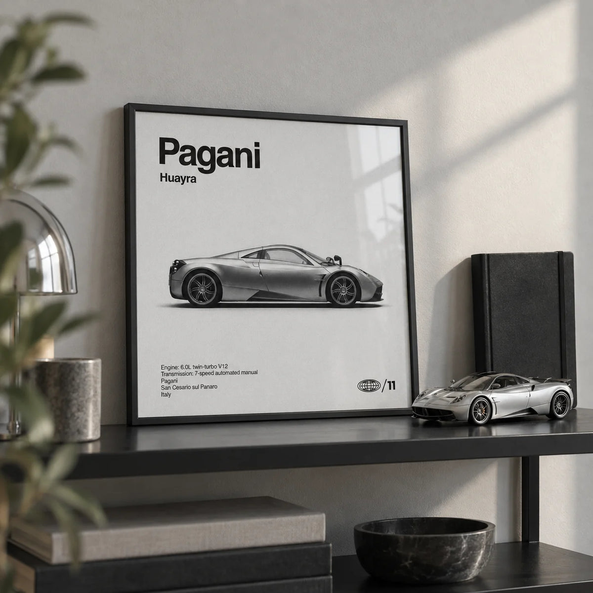 Italian Hypercar Poster, a small A4 framed print leaning on a black metal shelf in a living room