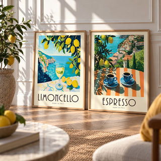 Italian Kitchen Prints Set of 2 styled leaning against a white panelled wall on herringbone parquet: Amalfi Limoncello and Amalfi Espresso shown framed side by side (frames not included)