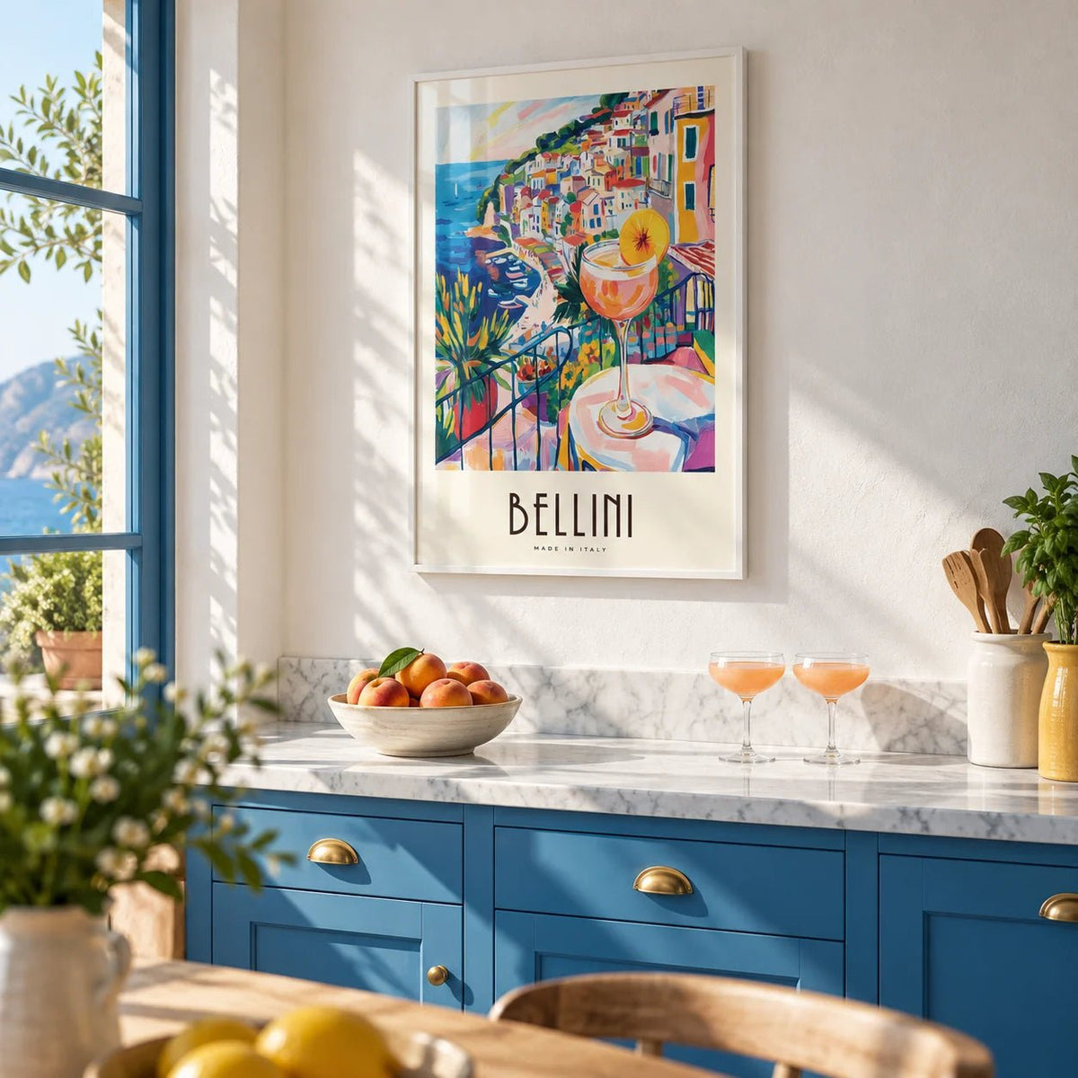 Italian Style Cocktail Wall Art, framed on the wall of a bright Italian kitchen with solid sea blue painted cabinets and white plaster walls