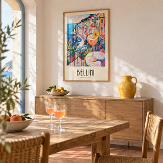 Italian Style Cocktail Wall Art, framed on the wall of a Riviera-style dining room with whitewashed plaster walls and a plain terracotta floor