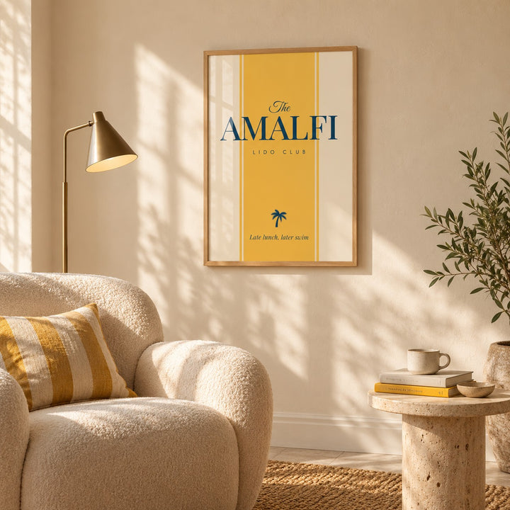 Italian Travel Poster hung above a boucle armchair in a reading corner (frame not included)