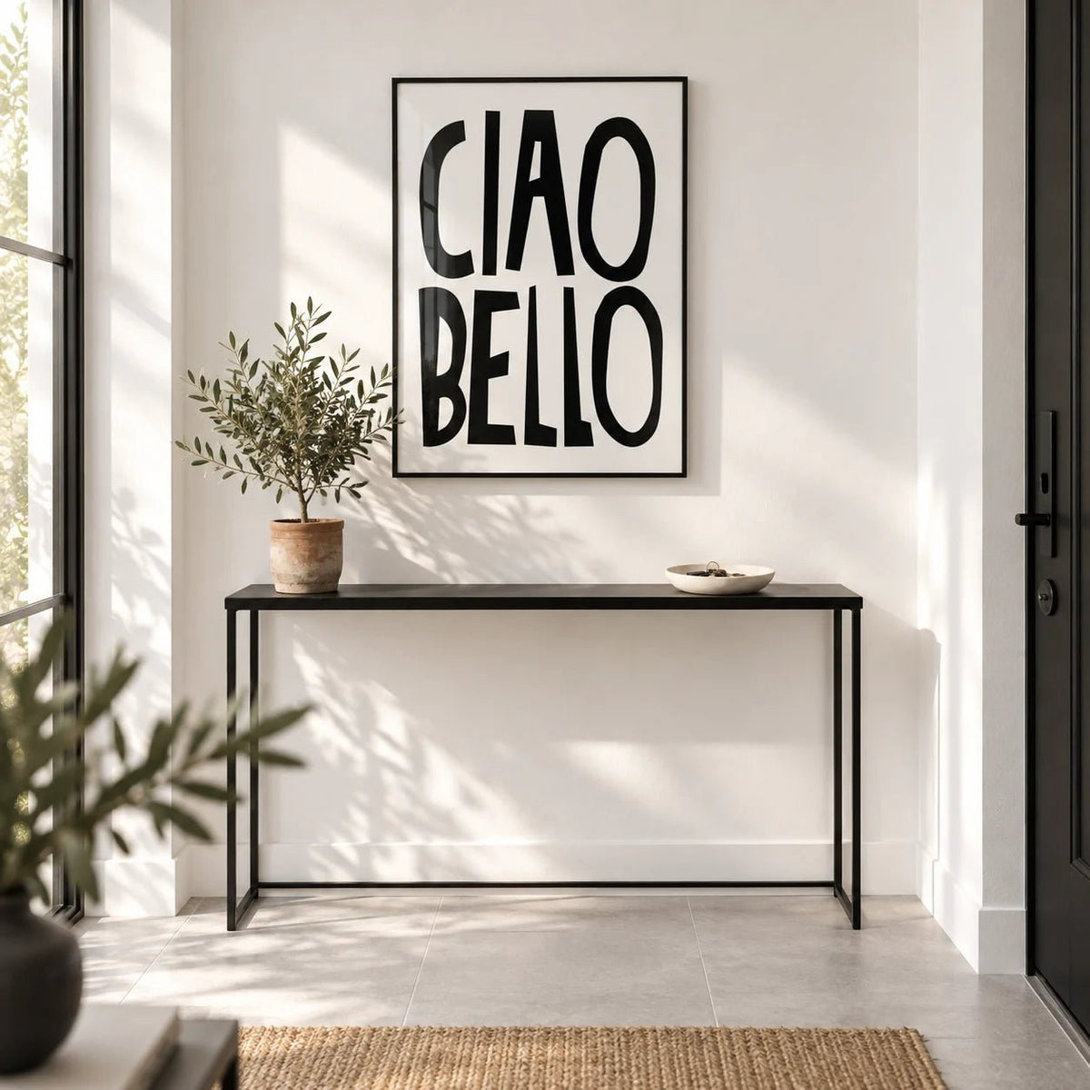 Italian Wall Art, framed on the wall of a bright modern entrance hall by the front door with a white wall and a plain pale grey stone floor