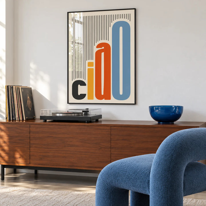 Italian Wall Art, framed on the wall of a music nook with a blue armchair in a living room