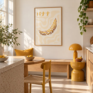 Japanese Banana Poster hung above a breakfast bench in a colourful minimalist kitchen (frame not included)