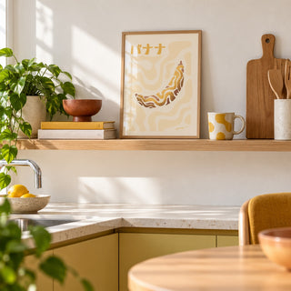 Japanese Banana Poster in the small A4 size, leaning on a kitchen shelf (frame not included)