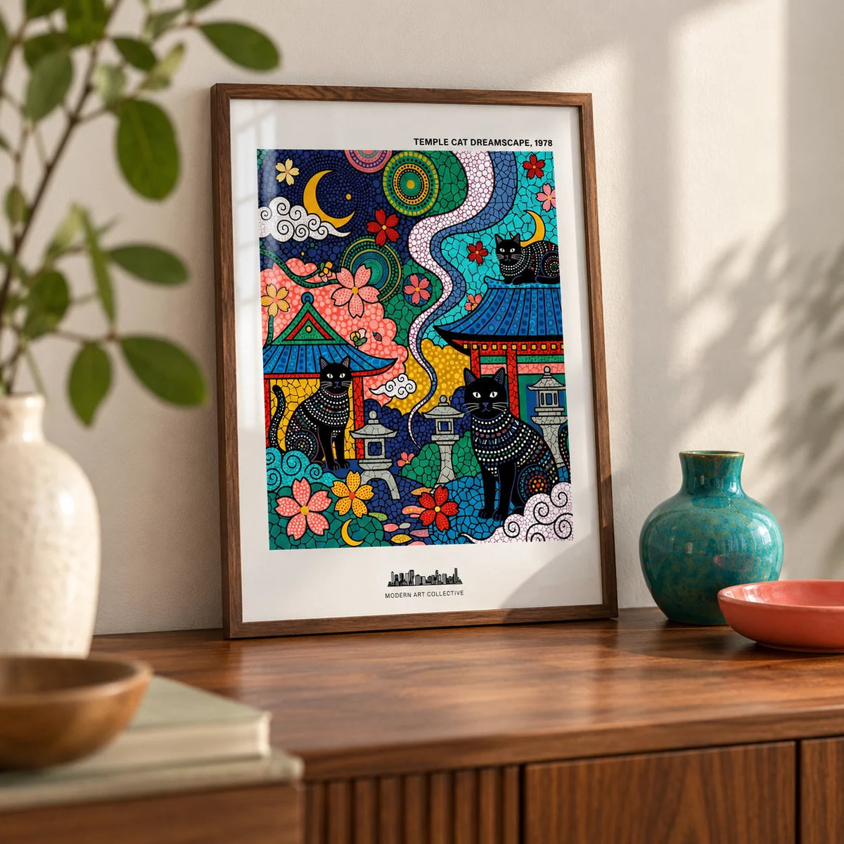 Japanese Cat Wall Art, a small A4 framed print leaning on a walnut sideboard in a living room