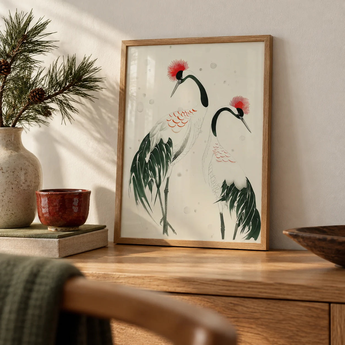 Japanese Crane Art, a small A4 framed print leaning on an oak shelf in a living room