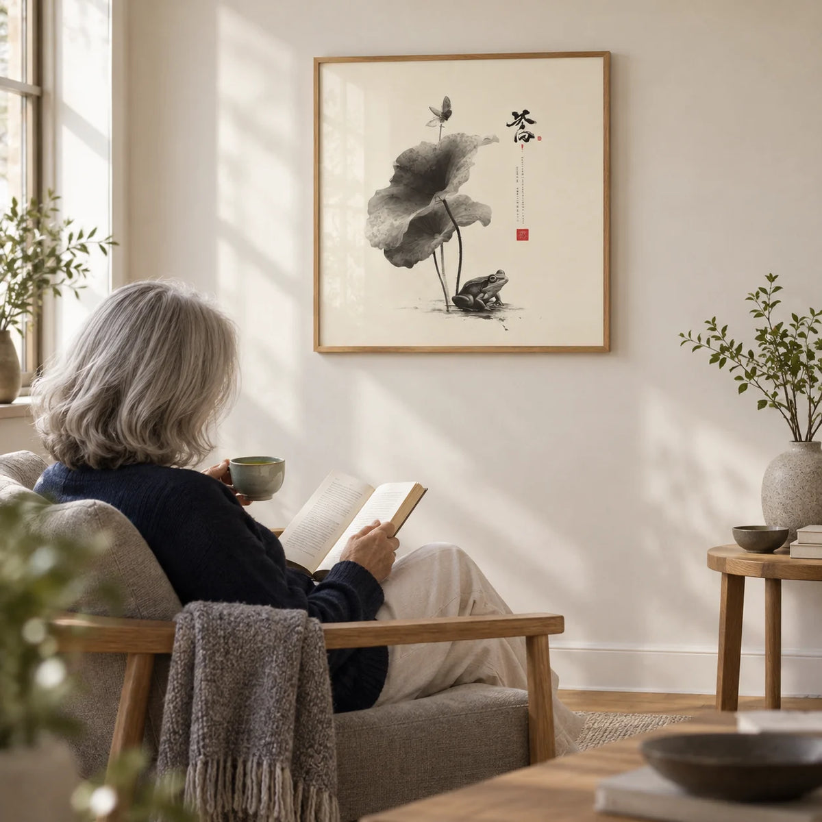Japanese Frog Art, framed on the wall of a quiet reading nook with a cream wall in a living room