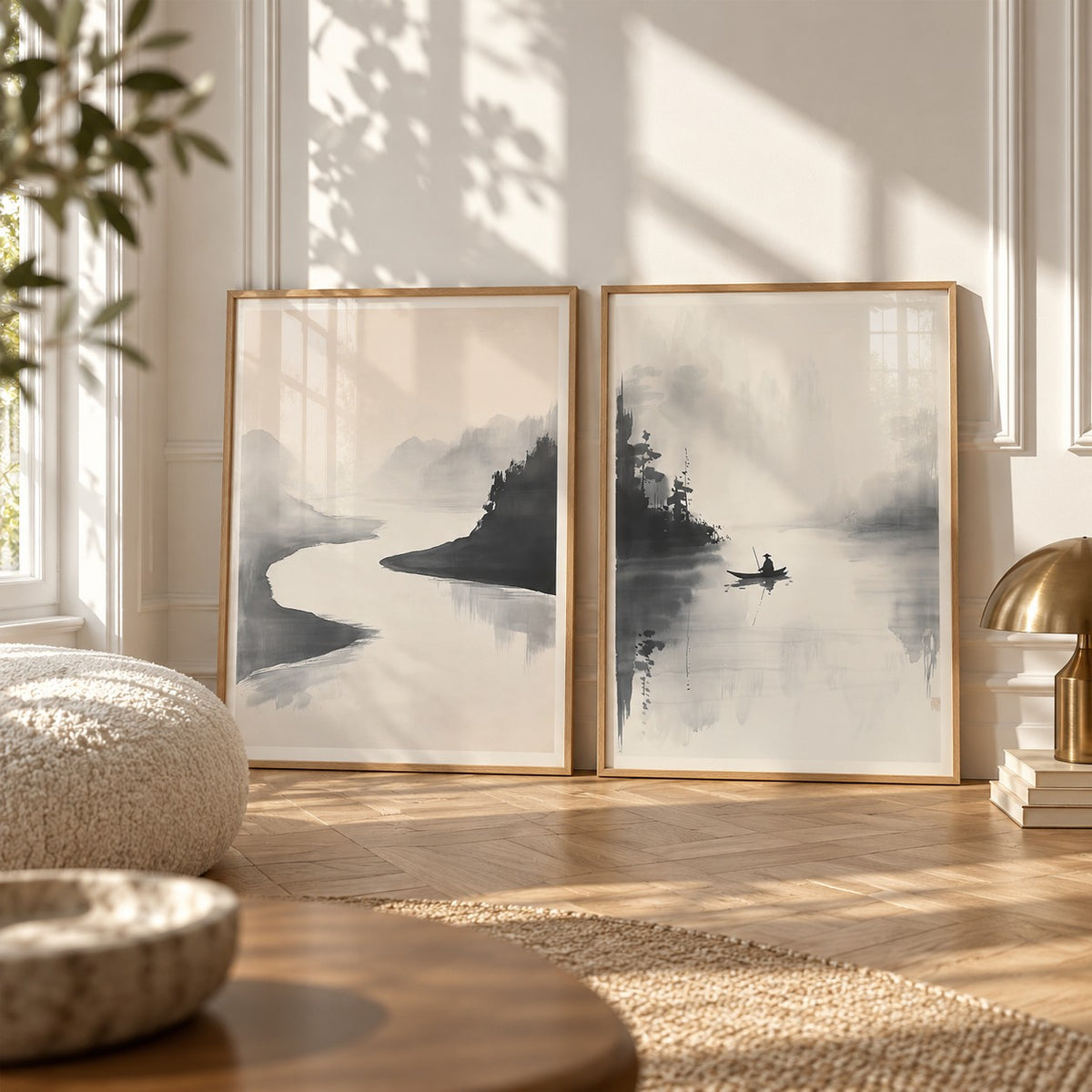 Japanese Ink Landscape Prints Set of 2 styled leaning on a herringbone floor between a boucle cushion and a brass mushroom lamp: River Quiet and River Stillness shown framed side by side (frames not included)