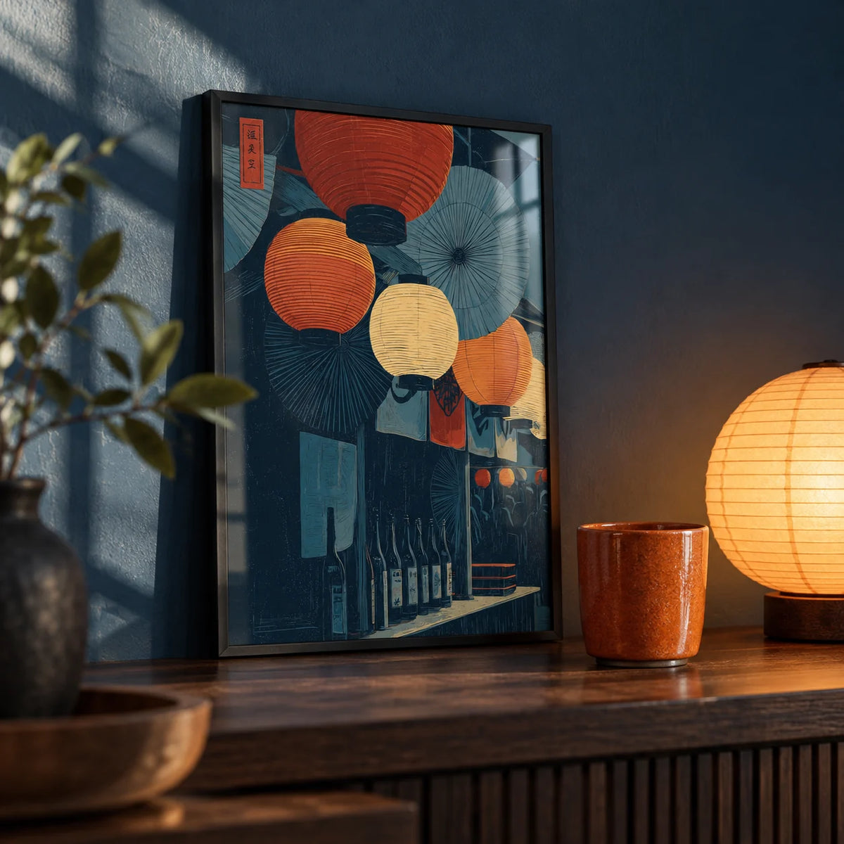 Japanese Lantern Wall Art, a small A4 framed print leaning on a dark wood shelf in a living room