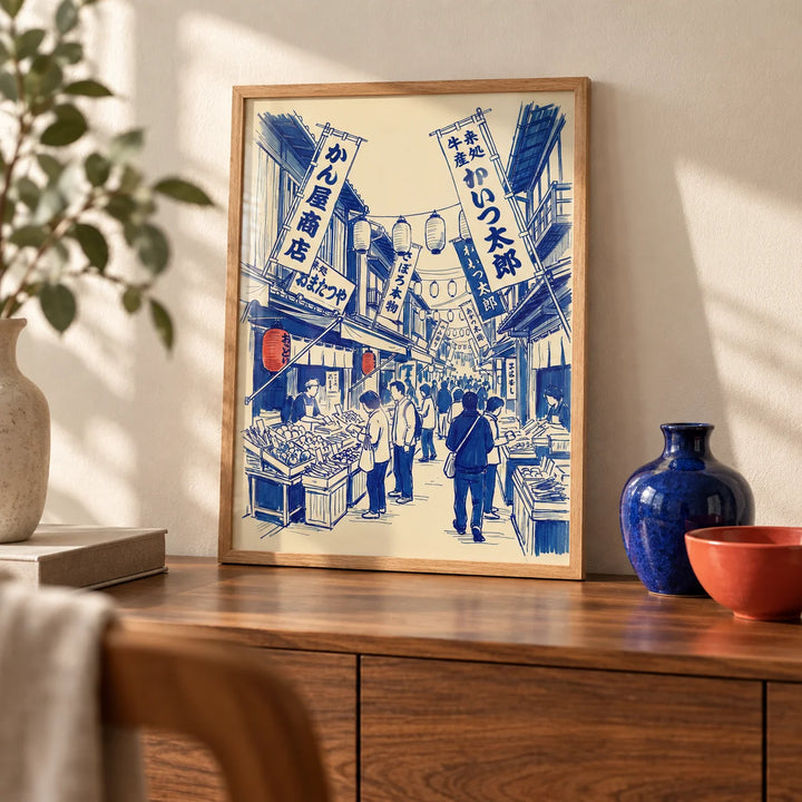 Japanese Market Art Print, a small A4 framed print leaning on a walnut sideboard in a living room