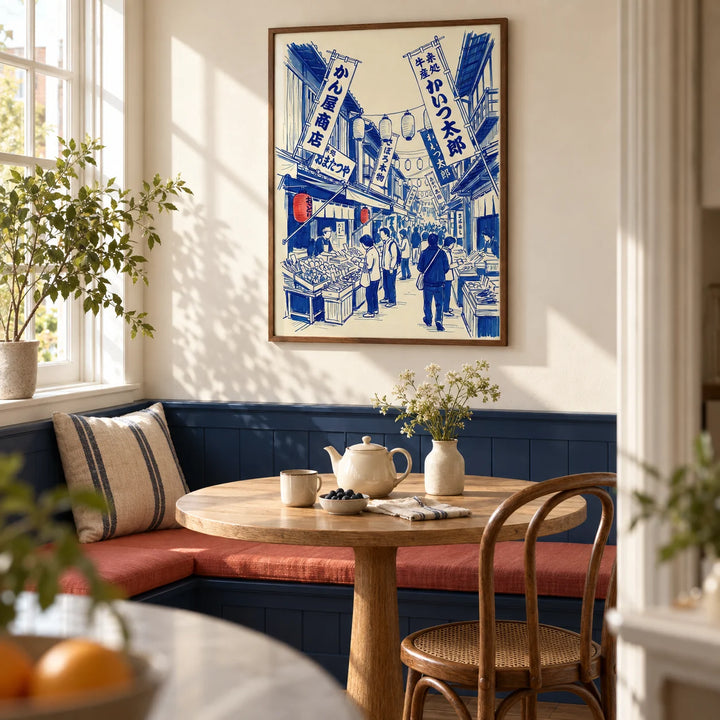Japanese Market Art Print, framed on the wall of a sunny breakfast nook in a terraced home with a cream wall and a built-in dark blue bench in a kitchen