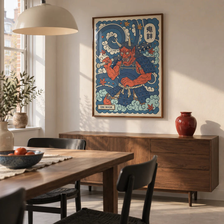 Japanese Oni Mask Print, framed on the wall of a compact modern dining room in a renovated UK terrace with warm white plaster walls and a pale concrete floor