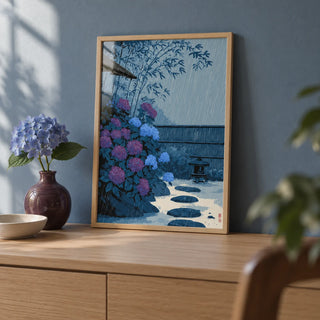 Japanese Rain Print, a small A4 framed print leaning on a pale oak sideboard in a living room
