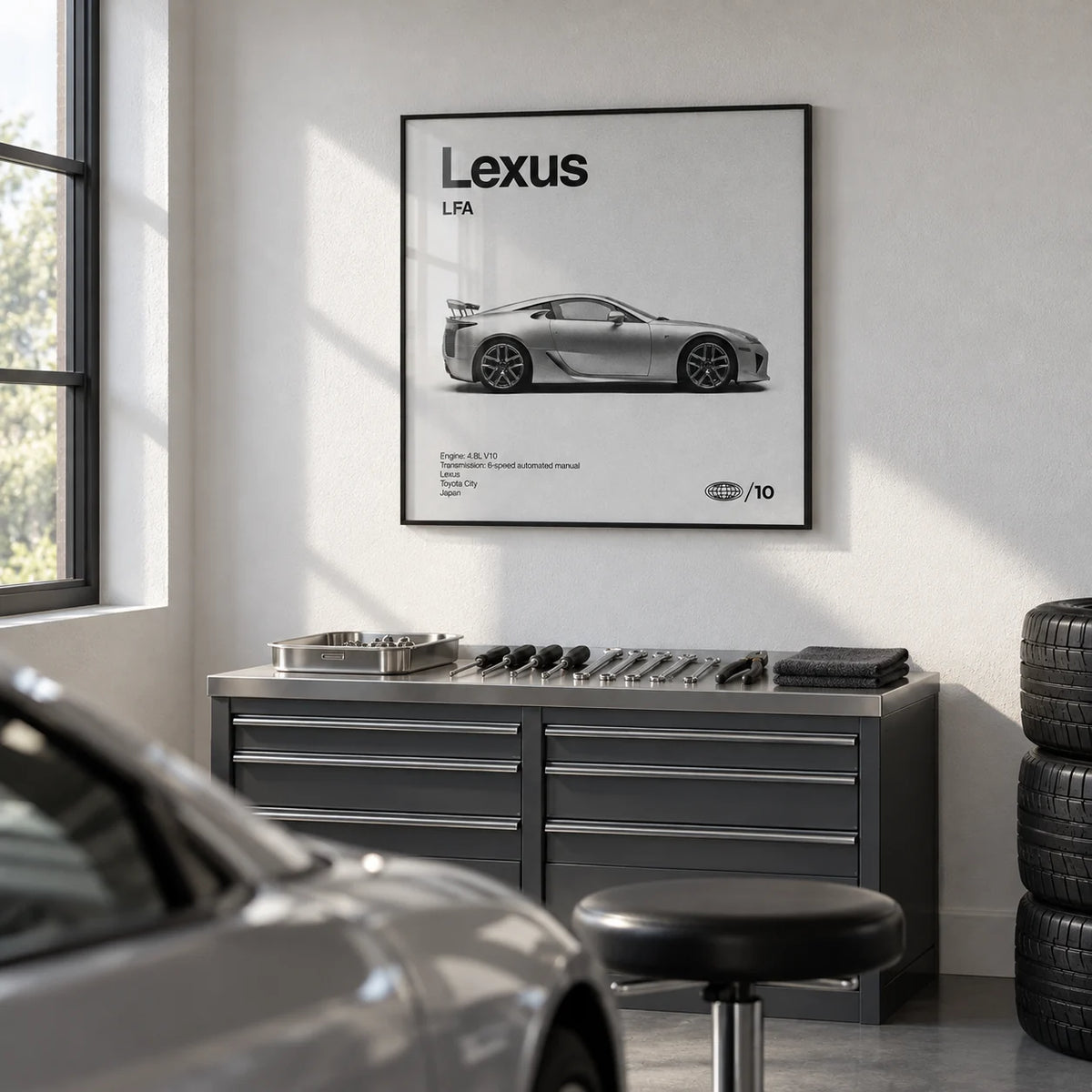 Japanese Supercar Poster, framed on the wall of a clean garage studio with a white wall and a grey floor in a home office