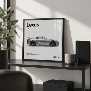 Japanese Supercar Poster, a small A4 framed print leaning on a black metal shelf in a living room