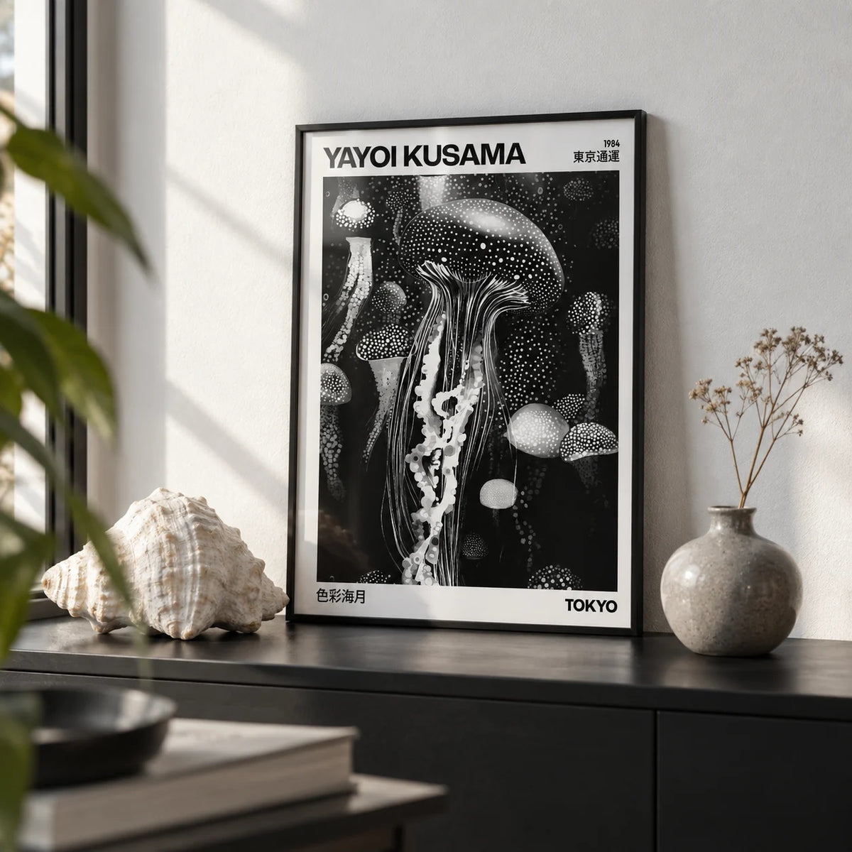 Jellyfish Art, a small A4 framed print leaning on a black shelf in a living room