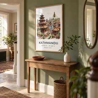 Kathmandu Art Print, framed on the wall of a welcoming hallway in a UK period flat with a muted leafy green wall and pale stone flooring
