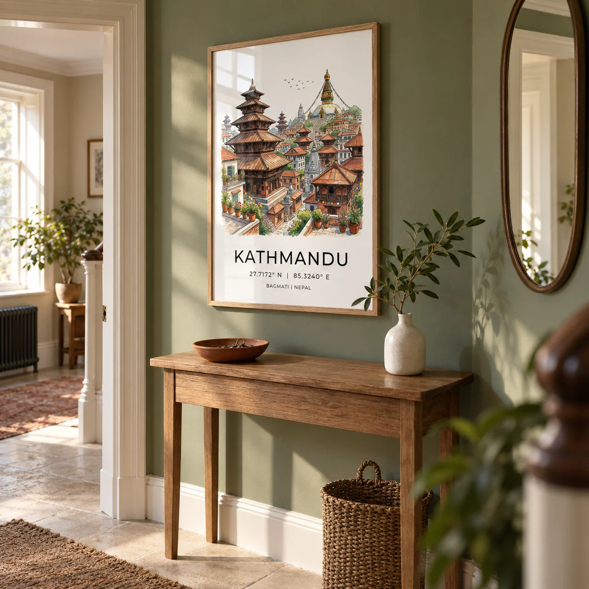 Kathmandu Art Print, framed on the wall of a welcoming hallway in a UK period flat with a muted leafy green wall and pale stone flooring