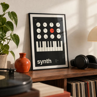 Keyboard Poster, a small A4 framed print leaning on a walnut shelf in a living room