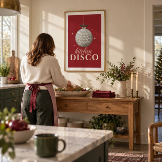 Kitchen Disco Print, framed on the wall of a bright open-plan kitchen with a warm cream wall