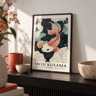 Koi Carp Wall Art, a small A4 framed print leaning on a black shelf in a living room