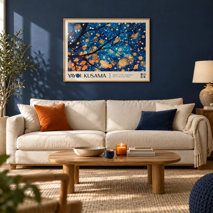 Kusama Art, framed on the wall of a calm living room with a deep navy painted wall and a pale oak floor