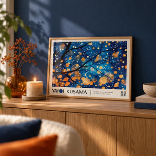 Kusama Art, a small A4 framed print leaning on a low oak sideboard in a living room