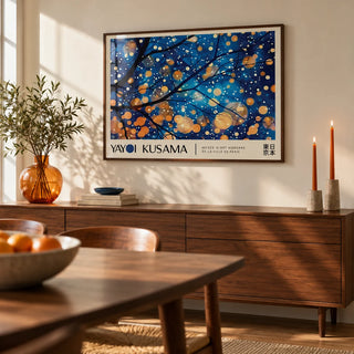 Kusama Art, framed on the wall of a warm dining room with a cream wall