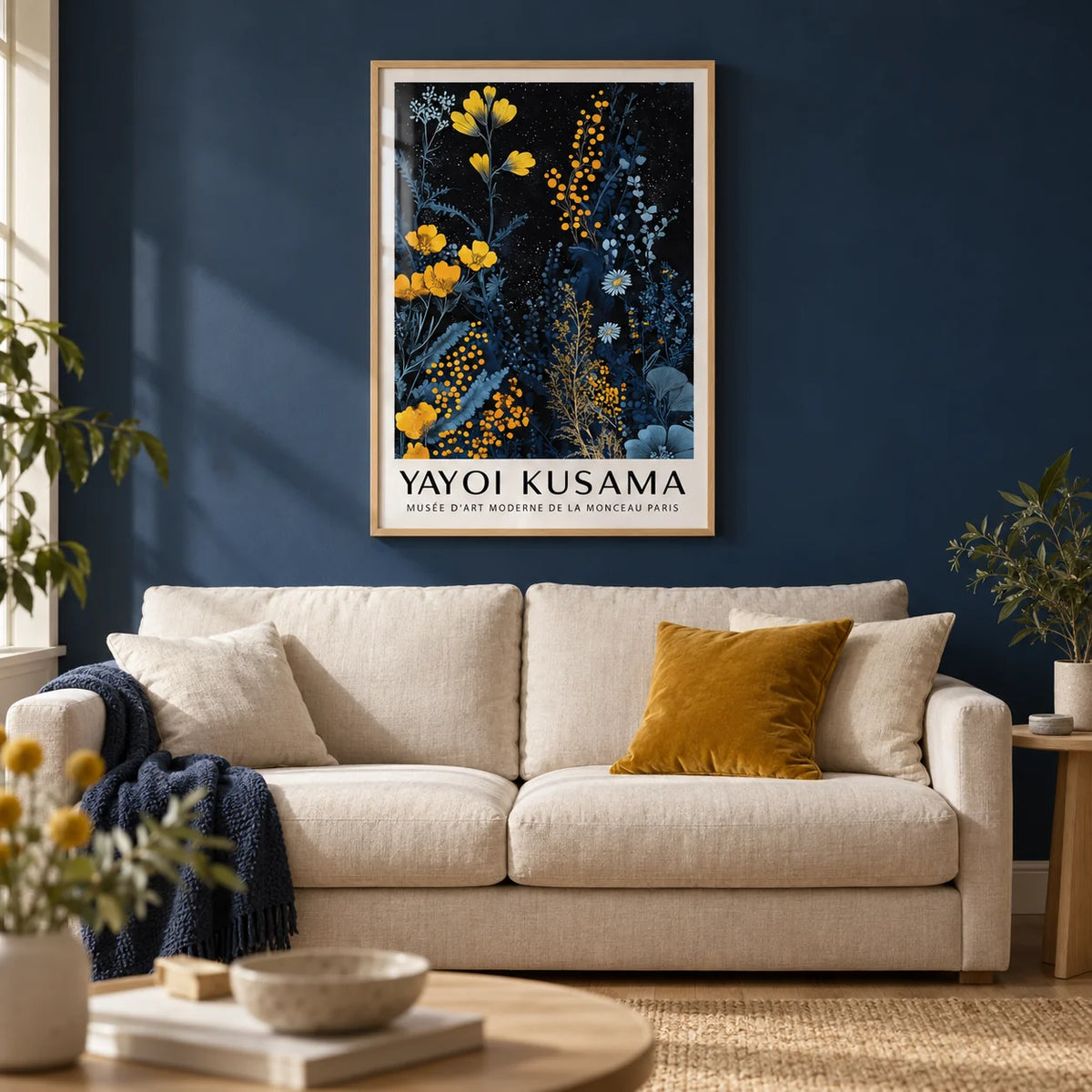 Kusama Museum, framed on the wall of a calm living room with a deep navy painted wall and a light oak floor
