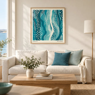 Kusama Paintings, framed on the wall of a modern living room in a UK seaside flat with warm white walls