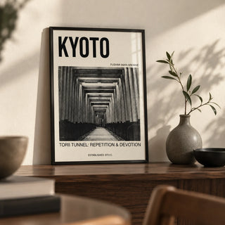 Kyoto Torii Tunnel Art Print, a small A4 framed print leaning on a walnut shelf in a living room