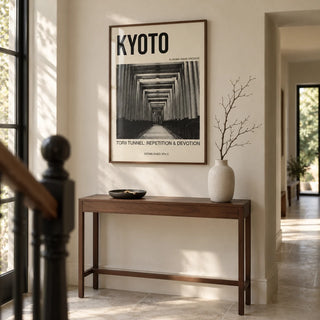 Kyoto Torii Tunnel Art Print, framed on the wall of a thoughtfully renovated terraced-house hallway with an ivory wall and pale stone floor