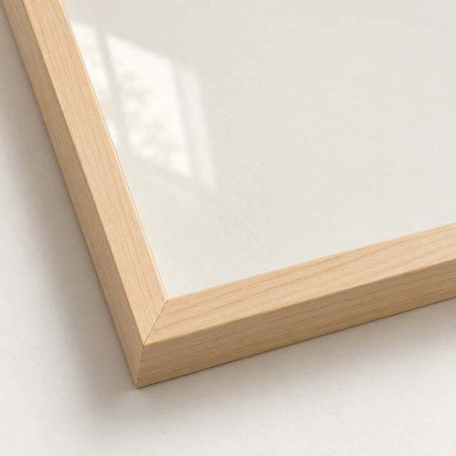 Corner of a natural wood pine frame with clear Perspex glazing