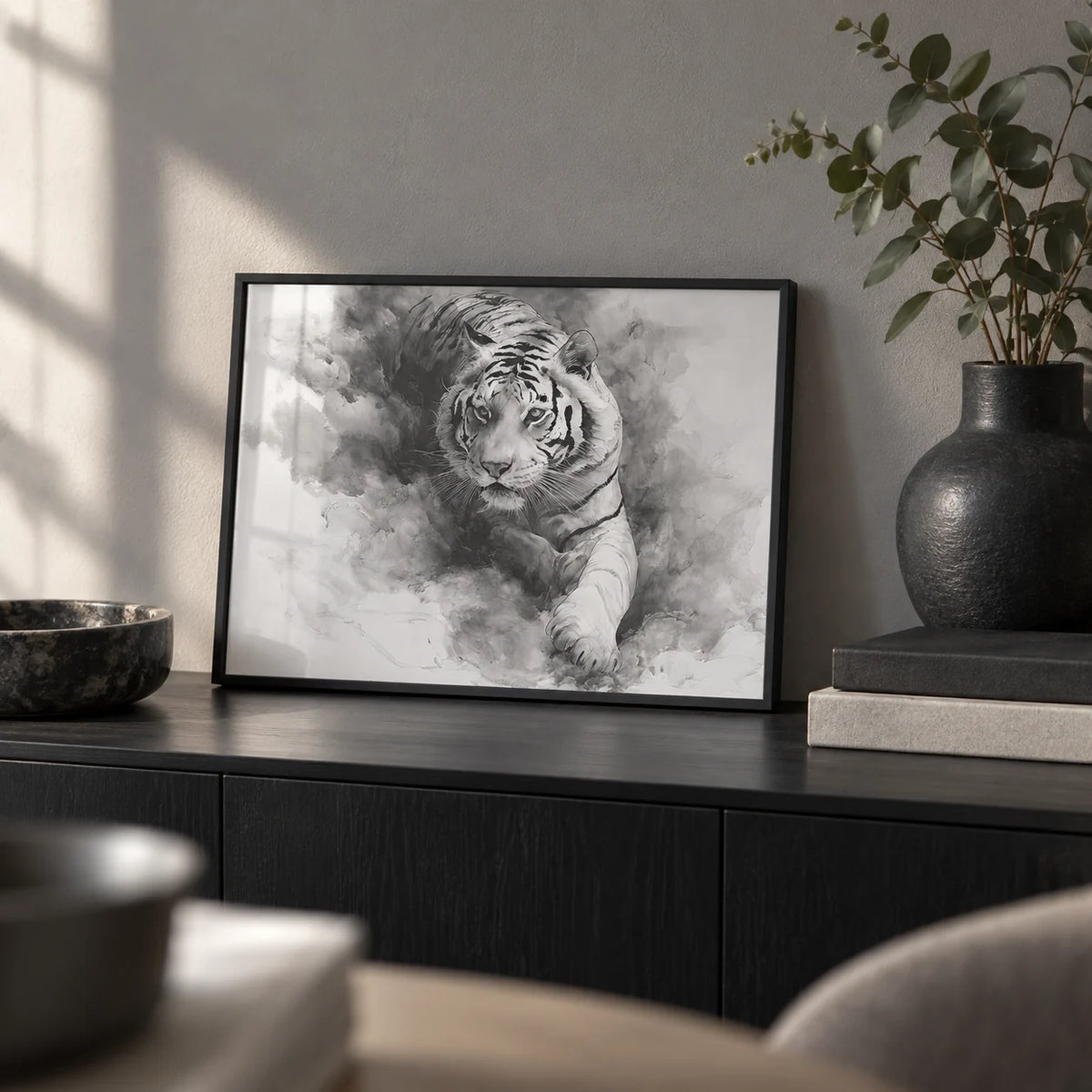 Landscape Tiger Print, a small A4 framed print leaning on a black sideboard in a living room