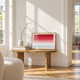 Cherry Ice Horizon Print, a small A4 framed print leaning on a small solid oak side table