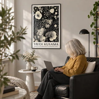 Large Floral Wall Art, framed on the wall of a reading corner with a pale grey wall in a living room