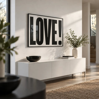 Large Motivational Posters, framed on the wall of a modern hallway with a white wall