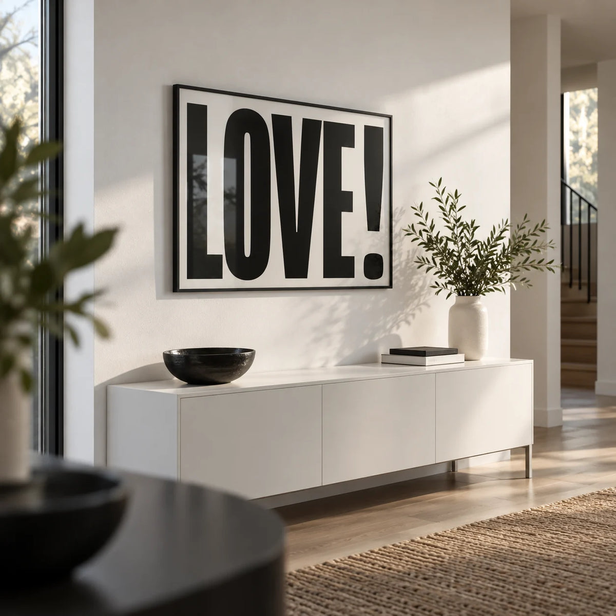 Large Motivational Posters, framed on the wall of a modern hallway with a white wall