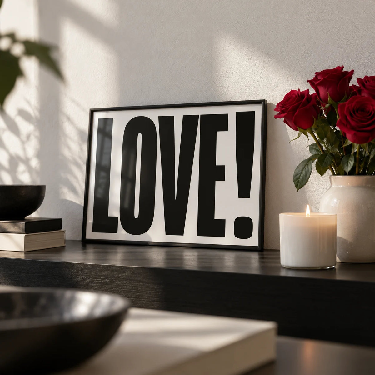 Large Motivational Posters, a small A4 framed print leaning on a black shelf in a living room
