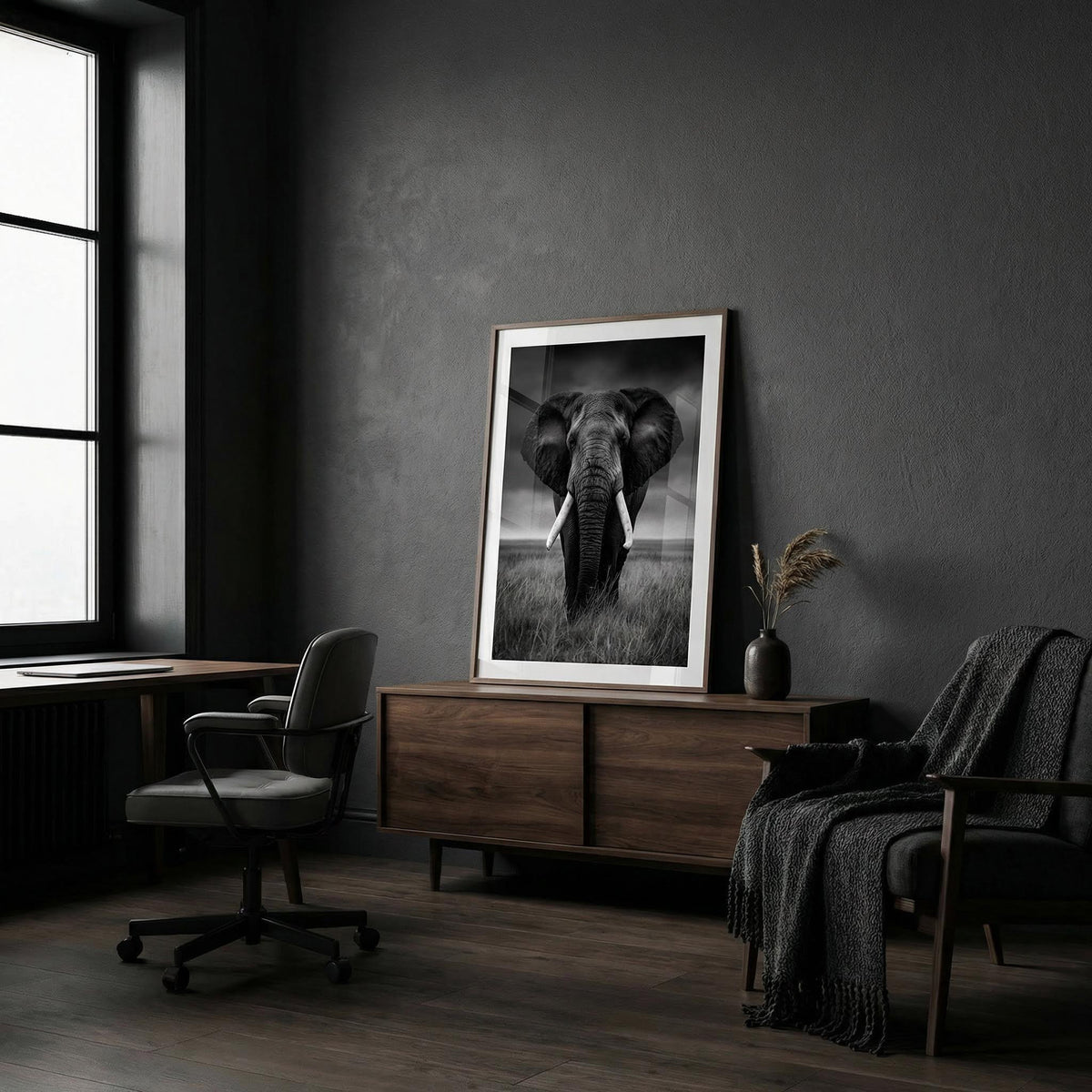 Modern interior with a large framed black and white elephant print on a dark wall.