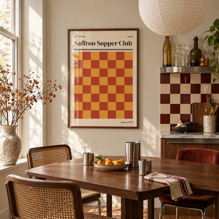 Leeds Print, framed on the wall of a kitchen dining corner by a tall window in soft daylight