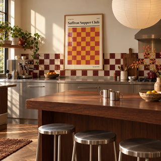Leeds Print, framed on the wall of a warm kitchen with a burgundy and cream checkerboard tile splashback and brushed steel cabinets