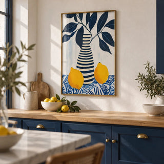 Lemon Art Print, framed on the wall of a Mediterranean-modern kitchen with solid navy cabinets and white limewashed walls